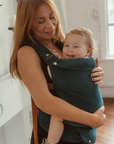 Happy baby's love being held close in a Chekoh Baby Clip Carrier. As seen on Mama Chelsea - shop the Cobalt Clip Carrier 2.0 